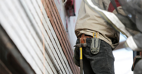 builder wearing tool belt
